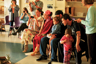 &lt;p&gt;Kalispel tribal members, from left, Wilma Cullooyah, her daughter Kayleen Sherwood, her fiance Anthony Shirahama holding Sherwood&#146;s daughter Wiset, and Raymond Finley with his daughter, Precious, watch as a student presents their project to them. In a cultural exchange, Farmin Stidwell fourth grade students outlined what they had learned about regional native peoples as part of five months of study of Idaho history. Idaho Mythweaver volunteer Jane Fritz, far right, moderated the exchange. (Photo by LEE HUGHES)&lt;/p&gt;