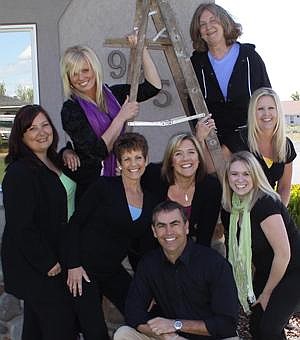 Courtesy photo<br> Moses Lake Family Dentistry staff are having a logo competition for students and teachers throughout the Columbia Basin. Owner Dr. Craig Harder, center, is putting together a grant program to provide financial support for teachers.