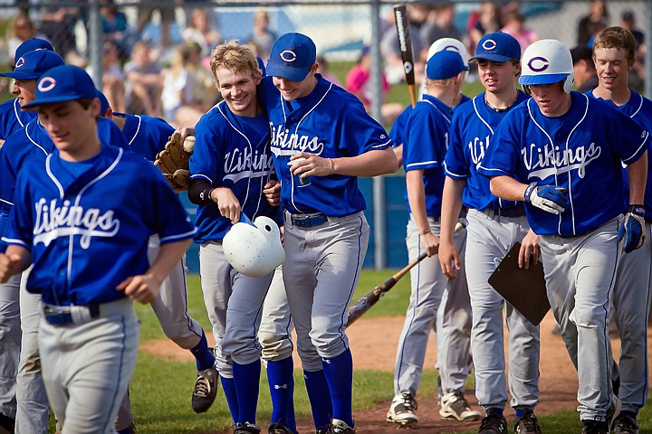 &lt;p&gt;Coeur d'Alene High's Devon Austin, left, is congratulated by his teammate Jake Matheson after hitting a three-run homer against Lake City in the Viking's 13-1 win Thursday.&lt;/p&gt;