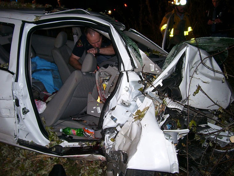 <p>In this Oct. 24, 2006 photo provided by the St. Croix County Sheriff's Office, police investigate the wreckage of a 2005 Chevrolet Cobalt that crashed in St. Croix County, killing Natasha Weigel, 18, and Amy Lynn Rademaker, 15, and injuring the 17-year-old driver, Megan Ungar-Kerns. The vehicle's ignition was found in the ?accessory? position and the air bags didn?t deploy. General Motors? recent recall of 2.6 million small cars, including the 2005 Cobalt, has shed light on an unsettling fact: Air bags might not always deploy when drivers _ and federal regulators _ expect them to. (AP Photo/St. Croix County Sheriff's Office)</p>