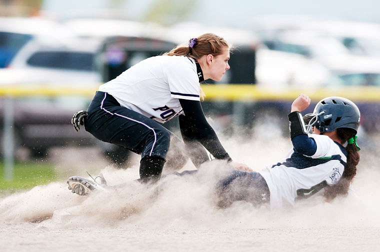 &lt;p&gt;Polson sophomore Hannah Potter (left) tags out Glaicer freshman Christina DuFour (4) on a steal attempt Thursday afternoon during Glacier's loss to Polson at Kidsports Complex in Kalispell. May 8, 2014 in Kalispell, Montana. (Patrick Cote/Daily Inter Lake)&lt;/p&gt;