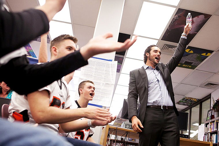 &lt;p&gt;Denver Broncos quarterback and former Flathead High School student Brock Osweiler, right, celebrates with his team of students after they converted a first down in a game of Financial Football, a video game to promote financial literacy, Friday morning at Flathead High School. May 9, 2014 in Kalispell, Montana. (Patrick Cote/Daily Inter Lake)&lt;/p&gt;