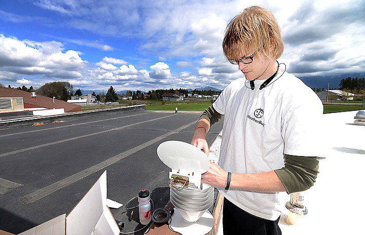 &lt;p&gt;Todd Enders of WeatherBug works to install a new weather station at Helena Flats School on Wednesday, May 7. The station will record several different kinds of data including temperature, humidity, rain and wind. (Brenda Ahearn/Daily Inter Lake)&lt;/p&gt;