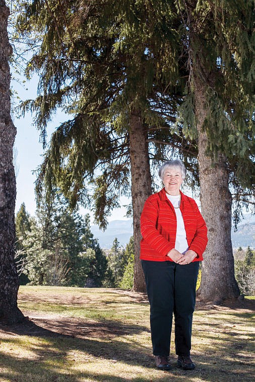 <p>Bette Albright poses near some of Kalispell's trees. Albright has been on the Kalispell Street Tree Commission since it was founded 25 years ago.</p>