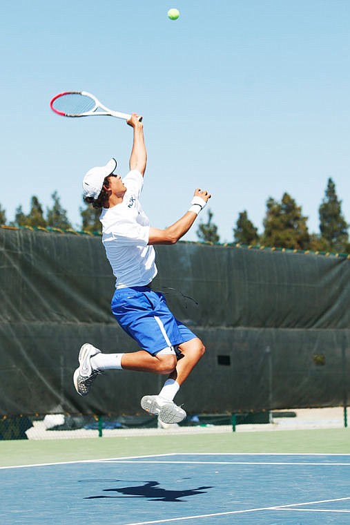 <p>Glacier's Kellen Bates stretches for the ball during his singles championship match Friday afternoon in the Northern AA divisional tennis tournament at Flathead Valley Community College.</p>