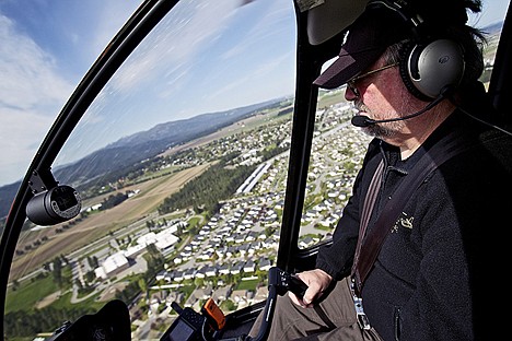 &lt;p&gt;Jim Van Sky banks his helicopter over the subdivisions near Hayden on a flight Wednesday.&lt;/p&gt;