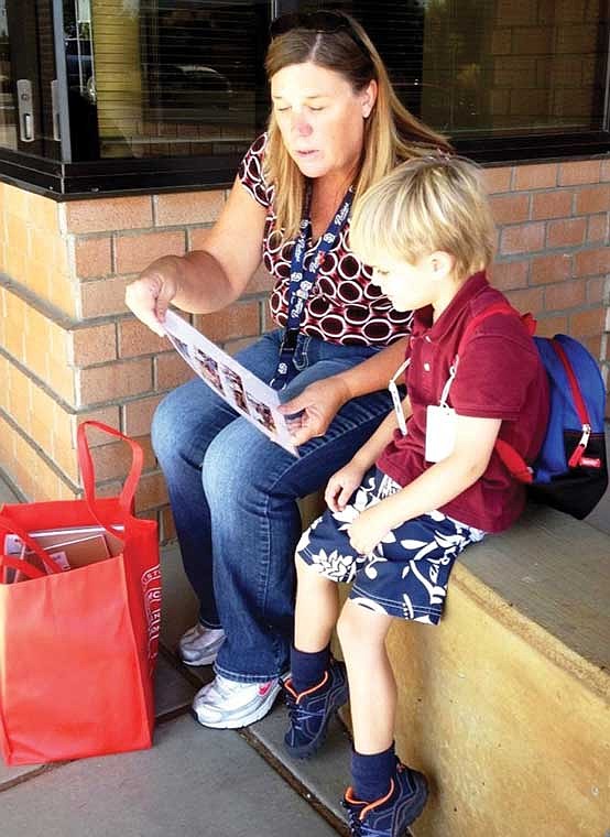 The family of an autistic boy (right) credits his kindergarten teacher at Sage Point Elementary and the school's willingness to collaborate as crucial components in the boy's progress.