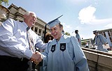 Trading his dustpan for a diploma