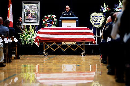 &lt;p&gt;Coeur d&#146;Alene Police Detective Johann Schmitz was a speaker at the funeral of Sgt. Greg Moore on Saturday at Lake City High School. Schmitz was a friend and colleague of Moore&#146;s.&lt;/p&gt;