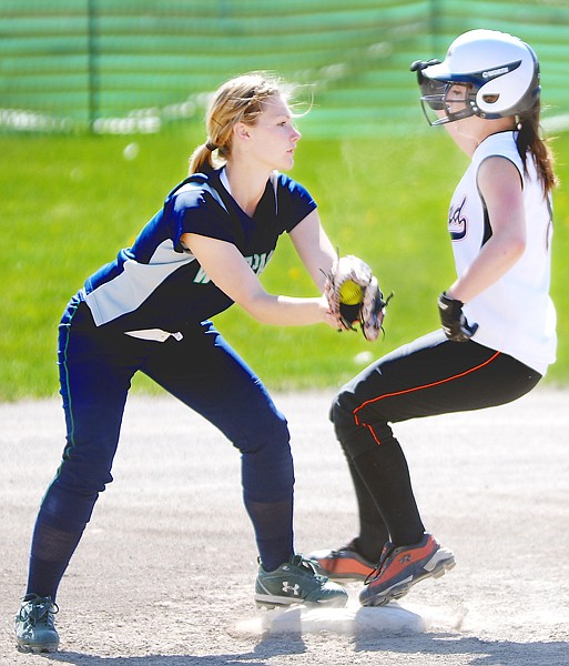 Glacier shortstop Paige Latimer makes the out at second against 
Flathead&#146;s Casey Roylston during their game on Thursday. Glacier went on to win 10 to 0.