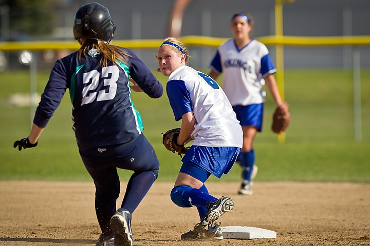 &lt;p&gt;Coeur d'Alene High's second baseman Elli Tindall keeps an eye on Kory Kritz from Lake City as she protects the base.&lt;/p&gt;