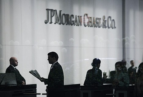 &lt;p&gt;People arrive at JPMorgan Chase headquarters in New York Monday, May 14, 2012. JPMorgan, the largest bank in the United States, is seeking to minimize the damage caused by a $2 billion trading loss, disclosed Thursday by CEO Jamie Dimon. (AP Photo/Mark Lennihan)&lt;/p&gt;