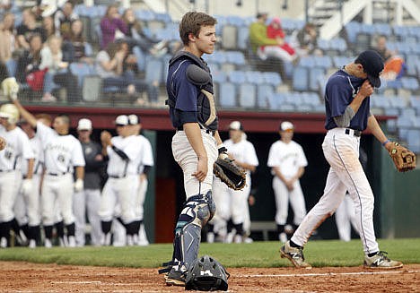 &lt;p&gt;Lake City catcher Reilly Cherry reacts after his overthrow to first base resulted in the first run of the game for Capital. Capital beat Lake City 4-0 in the first round of the state 5A baseball tournament Thursday at Memorial Stadium in Garden City.&lt;/p&gt;