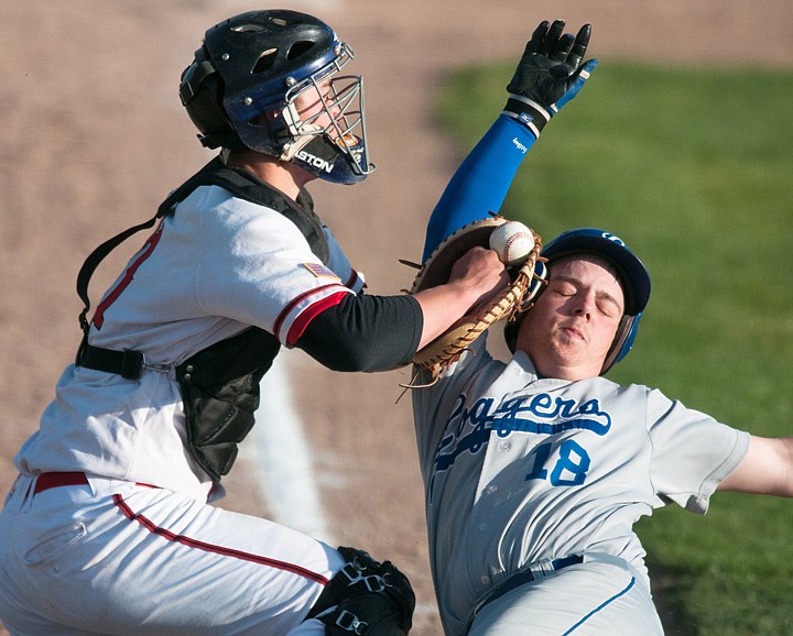 &lt;p&gt;Kalispell Lakers' catcher Brendan Windauer (left) tags out Loggers runner Micah Germany at home to get the last out of the top of the fifth inning during the Lakers matchup against Libby Wednesday night at Griffin Field.&#160;&lt;/p&gt;