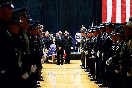 &lt;p&gt;Pastor Rodney Wright from Lake City Community Church prepares to exit the funeral of Sgt. Greg Moore at Lake City High School on Saturday.&lt;/p&gt;