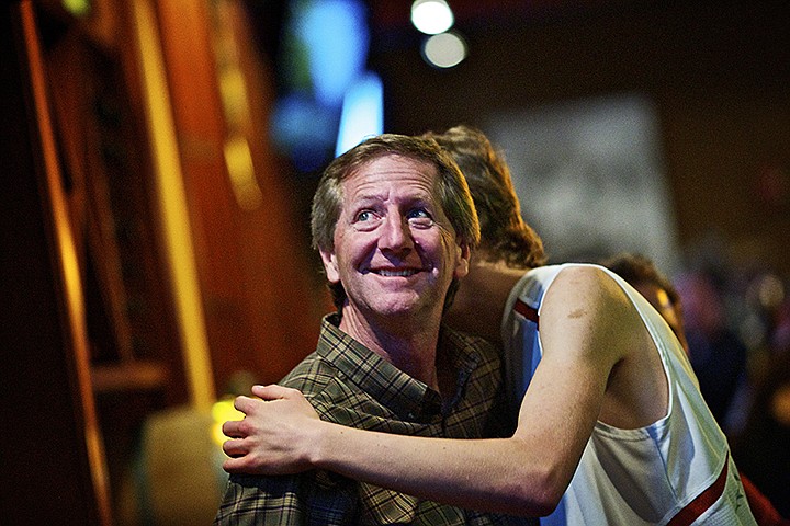 &lt;p&gt;JEROME A. POLLOS/Press Dan Green, a Kootenai County commissioner, receives a hug from his son Brett, 20, as they wait for election results to be posted Tuesday at the Kootenai County Reagan Republicans election party at Fedora's.&lt;/p&gt;