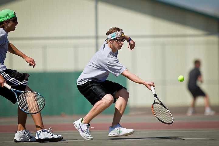 &lt;p&gt;Lake City High's Matt Gencarella races up to a short shot as his double's partner Dimitri Christo backs him up Saturday during the 5A Region 1 tournament.&lt;/p&gt;