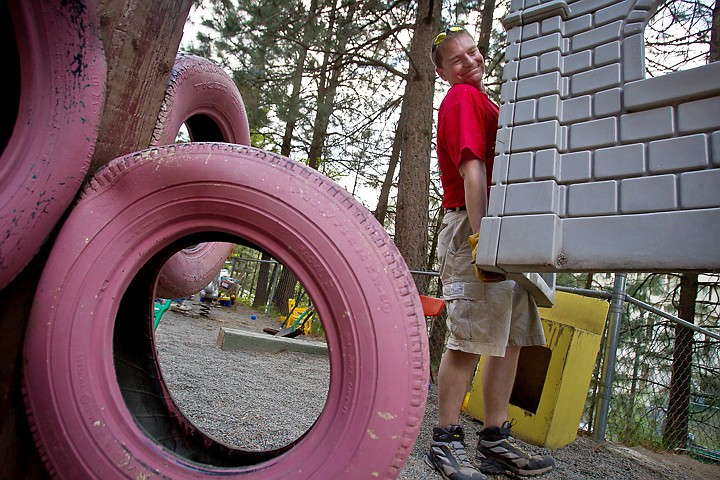 &lt;p&gt;Jared Olbricht, with Keller Williams Realty Coeur d'Alene, carries out a discarded piece of playground equipment Thursday at the Little Folks Preschool and Kindergarten.&lt;/p&gt;