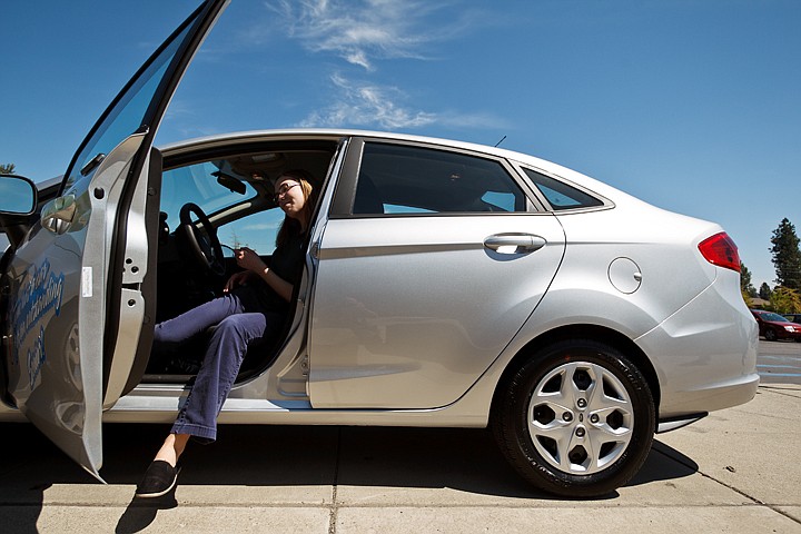 &lt;p&gt;SHAWN GUST/Press Katie Walter, a Coeur d'Alene Charter academy student, checks out the 2012 Ford Fiesta that she won Tuesday in the annual Tom Addis giveaway.&lt;/p&gt;