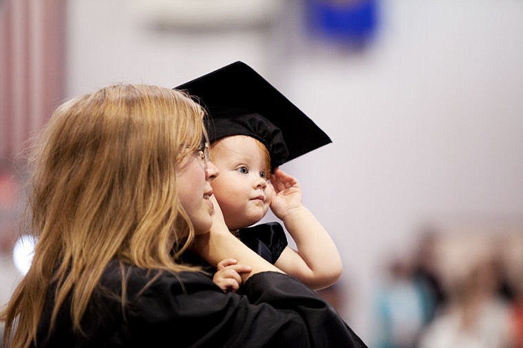 &lt;p&gt;Fifteen-month-old Hattie DeVries-Treat wears her mother's graduation cap Friday evening during the 2014 Flathead Valley Community College commencement ceremony in the Trade Center at the Flathead Valley Fairgrounds in Kalispell. Kimberly DeVries is graduating with an associate of science degree with a focus in pre-nursing. (Patrick Cote/Daily Inter Lake)&lt;/p&gt;