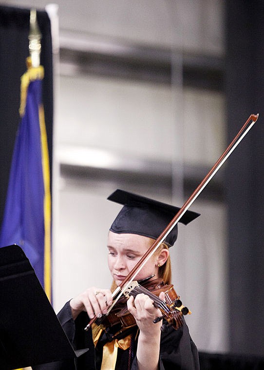 &lt;p&gt;Rachel Wambeke plays the violin Friday evening during the 2014 Flathead Valley Community College commencement ceremony in the Trade Center at the Flathead Valley Fairgrounds. (Patrick Cote/Daily Inter Lake)&lt;/p&gt;