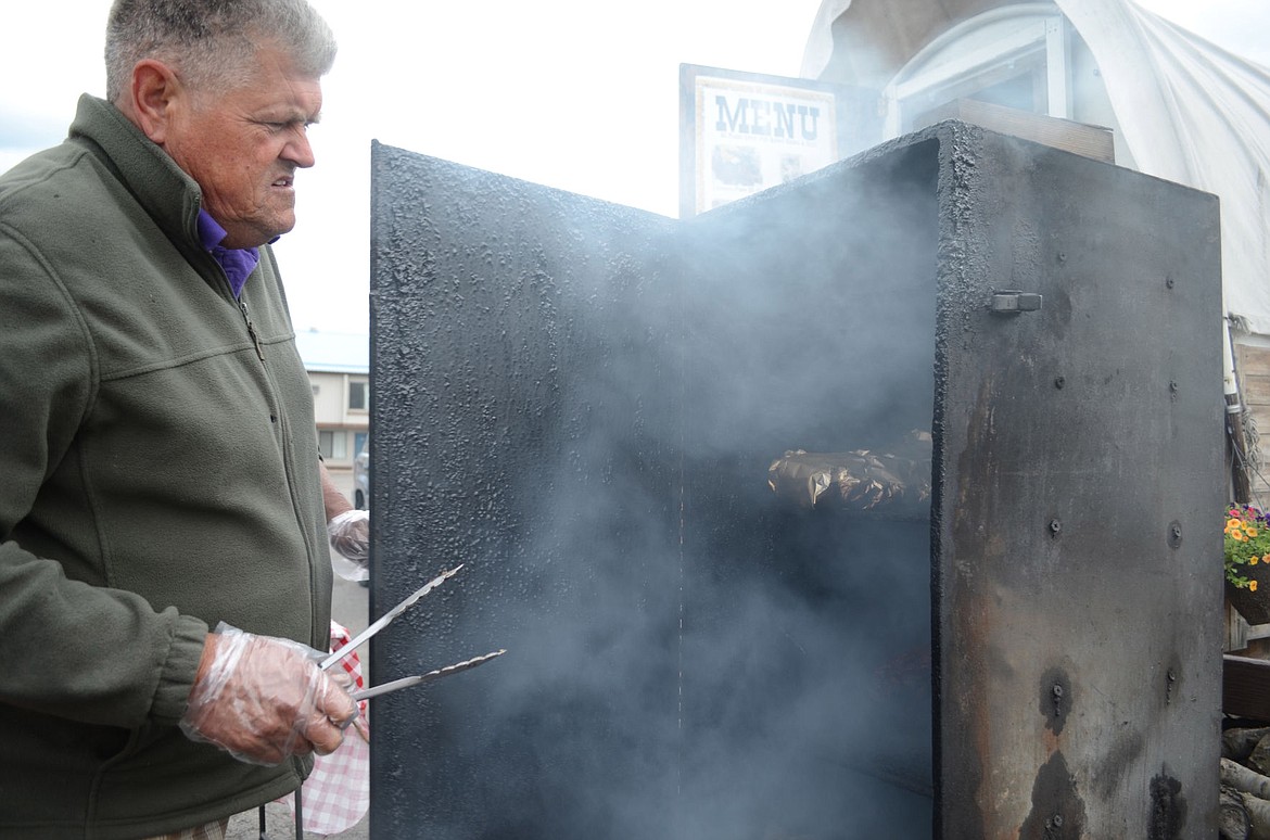 &lt;p&gt;Findley smokes meat for several days near his mobile vendor, Billy Bob's Chuckwagon Barbecue. (Seaborn Larson/Daily Inter Lake)&lt;/p&gt;