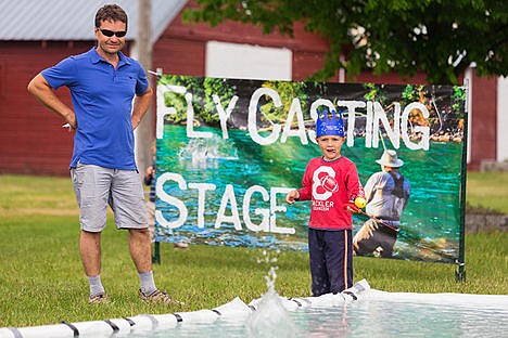 &lt;p&gt;Theory Provost, 5, drops a line in a shallow pool at the Becker&#146;s Tackle Shop fly casting booth as his father Phil watches.&lt;/p&gt;