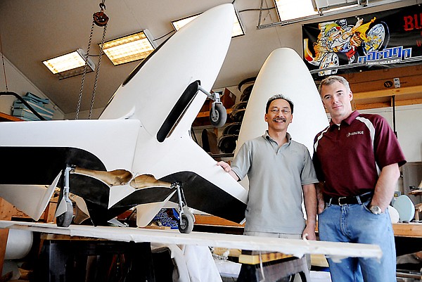 John McGinnis, left, and John Paul Noyes in the shop where they are currently working to construct the full size version of their plane.