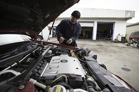 &lt;p&gt;Clyde Rilliet, owner of Affordable Transmissions, checks the transmission fluid on a vehicle Thursday at the Dalton Gardens shop. Pioneer Human Services has proposed a halfway house for federal prisoners at a local next to Rilliet's business, and he disapproves of the proposal.&lt;/p&gt;