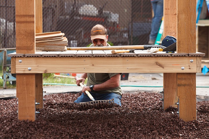 &lt;p&gt;Patrick Cote/Daily Inter Lake Bozeman Home Depot employee Gary Gotten spreads bark underneath a play structure Thursday morning during Team Depot Day at Discovery Developmental Center. Employees from all six Montana Home Depot stores &#8211; Billings, Bozeman, Great Falls, Helena, Kalispell and Missoula &#8211; attended the Team Depot Day in Kalispell. Thursday, May 17, 2012 in Kalispell, Montana.&lt;/p&gt;