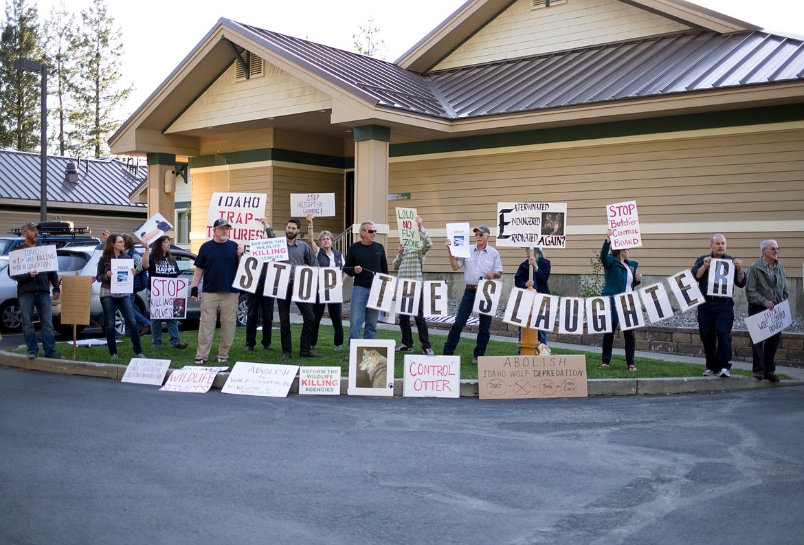 &lt;p&gt;More than 20 people gather on Monday outside the Idaho Department of Fish and Game Coeur d'Alene office to protest the controlled killing of wolves in Idaho.&lt;/p&gt;