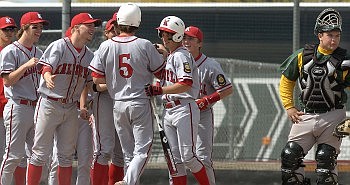 The Sherwood Park catcher looks away as Kalispell Lakers AA player Mario Venturini (5) receives congratulations from his teammates after hitting a home run in the bottom of the second inning during the Canadian Days Baseball Tournament at Griffin Field Saturday afternoon.(Allison Money/Daily Inter Lake)'