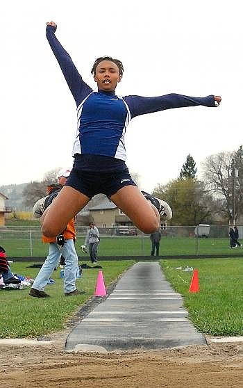 Glacier High School triple jumper Kayla Smart flies toward the sand pit at Legends Stadium Tuesday afternoon. Smart finished third with a distance of 31-11 1/2. Allison Money photo/Daily Inter Lake