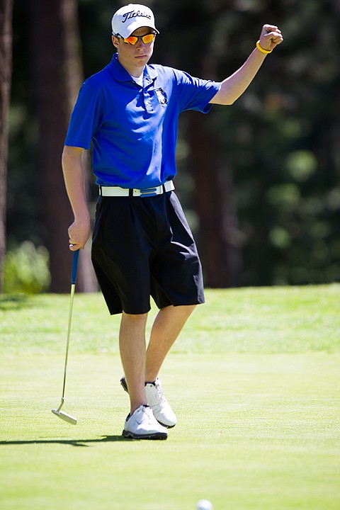 &lt;p&gt;Alex Pounds raises his fist in celebration as he sinks a putt at the 5A Region 1 Golf Tournament last week in Hayden. Pounds recently signed to play gold for Spokane Community College.&lt;/p&gt;