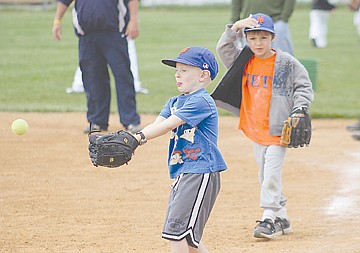 &lt;p&gt;With the throw comin' in hot, Teague McElwee of Polson braces for impact as Alex Licano looks on. McElwee and Licano were two of many area kids who took the diamond at O'Maley Park for this weekend's baseball camp run by the Mission Valley Mariners.&lt;/p&gt;