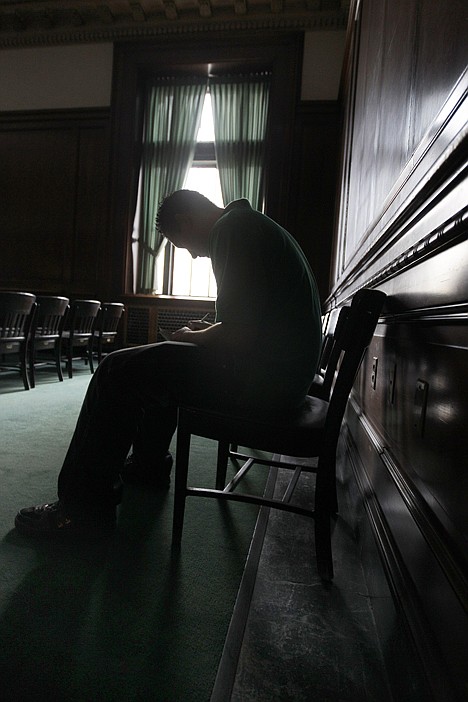 &lt;p&gt;In this April 12 photo, Paul Kader II fills out a job application during a career fair in Buffalo, N.Y. The number of people seeking U.S. unemployment benefits was unchanged last week, suggesting steady gains in the job market.&lt;/p&gt;