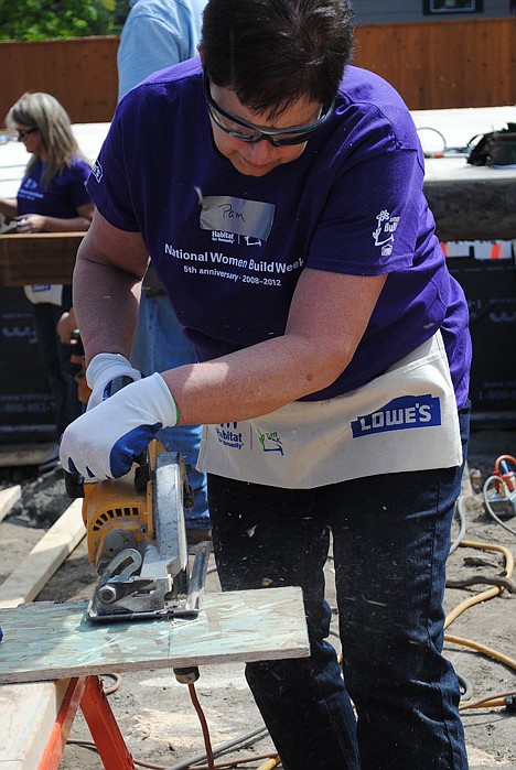 &lt;p&gt;Pam Rogness works on a Habitat for Humanity home in Coeur d'Alene.&lt;/p&gt;