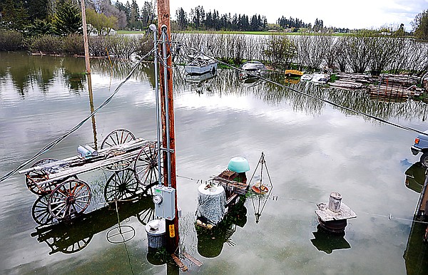 Flood waters from Trumbull Creek cover the property of Garry Stansberry on Tuesday morning west of Columbia Falls. Stansberry said his garage already had four inches of water in it. Several friends and neighbors already stopped by to check on Stansberry, who experienced similar flooding last year and previous years.