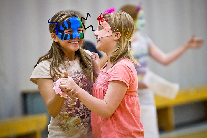 &lt;p&gt;SHAWN GUST/Press Tristin Morgan, left, and Hailey Sessions, fifth-graders at Seltice Elementary School in Post Falls, dance together Thursday as part of their Reader's Theater group's performance based on the book &quot;Shrek!&quot; by William Steig. Nearly 40 elementary and University of Idaho elementary education students have been working together since January to write and practice their own version of the story as part of the university's partnership with the Post Falls school district.&lt;/p&gt;