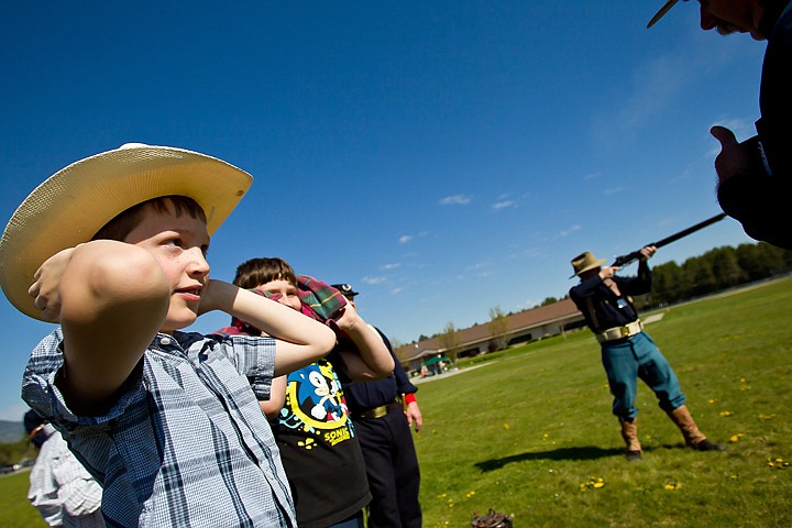 &lt;p&gt;JEROME A. POLLOS/Press Pieter Beukelman is told to cover his ears as James Teague demonstrates how his 1880's era carbine rifle is fired during Garwood Elementary's rendezvous Friday. Students learned about fur trapping, music, cooking, gold mining and soldiers of the late 1800s in North Idaho during the event.&lt;/p&gt;