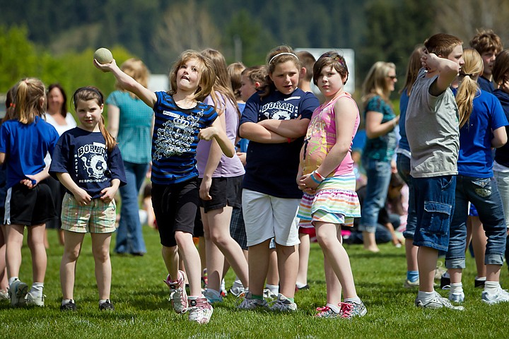 &lt;p&gt;JEROME A. POLLOS/Press Janessa Mackin heaves a softball 100-feet down the field during Borah Elementary's track and field event Friday. Students competed in throwing, kicking and jumping events as well as sprints and short distance races.&lt;/p&gt;
