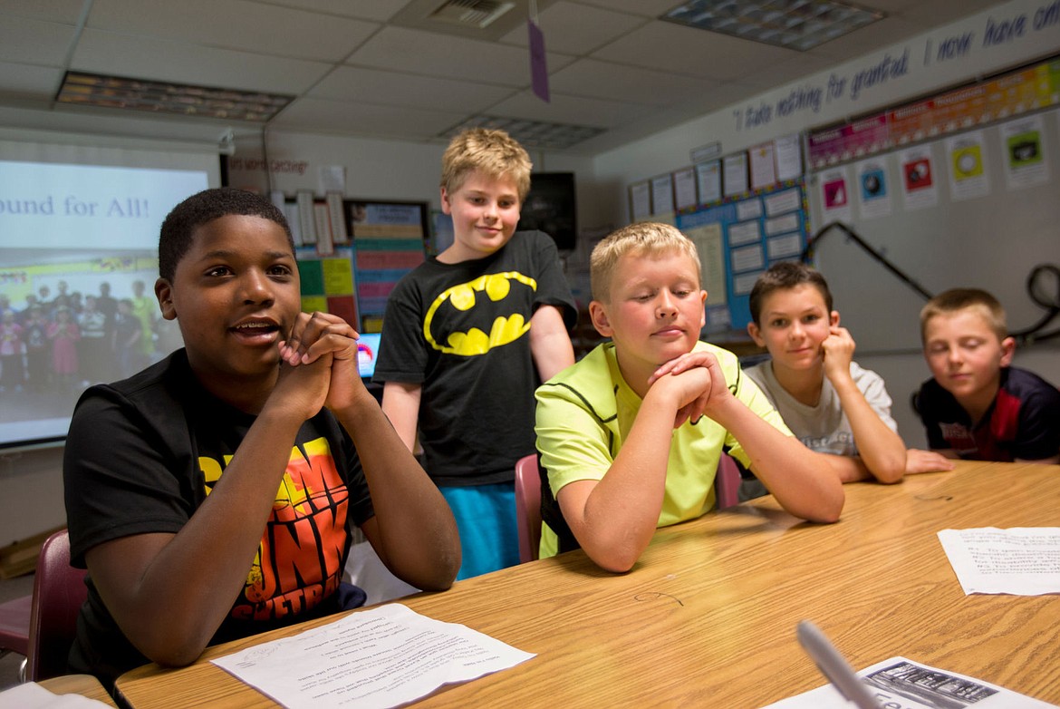 &lt;p&gt;Fernan STEM Academy fifth-grader Nate Bullock, left, talks about his hopes for the school's playground extension to better accommodate the school's special needs students as classmates Kevin Rose, Alex Green, Eddie Garner and Gage Hanson listen on Wednesday.&lt;/p&gt;