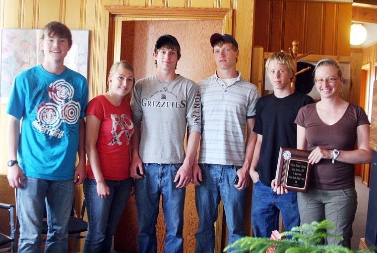 From left to right: Carter Montgomery, Kelsey Beagley, Taylor Firestone, Dillon Fryxell and Kenneth Beech presented a plaque to Emily Hernden (far right) for her help mending injuries for the track team members.