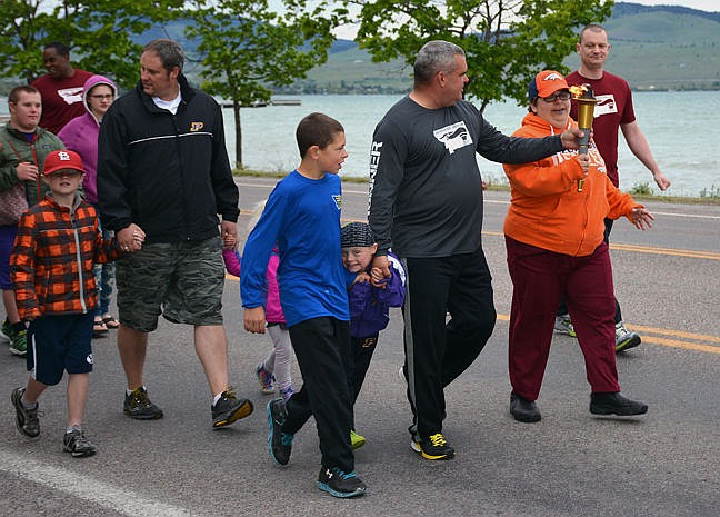 &lt;p&gt;&lt;strong&gt;Left, plaid, Tegen Gage and his father, Ryan Gage, walk near Keyen Nash, Kyler Gage, PPD Chief Wade Nash, Karen Ackom and PPD Corporal George Simpson.&lt;/strong&gt;&lt;/p&gt;&lt;p&gt;&lt;strong&gt;&#160;&lt;/strong&gt;&lt;/p&gt;