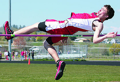 Banks Stocking clears the high jump at the District Track Meet in Polson.