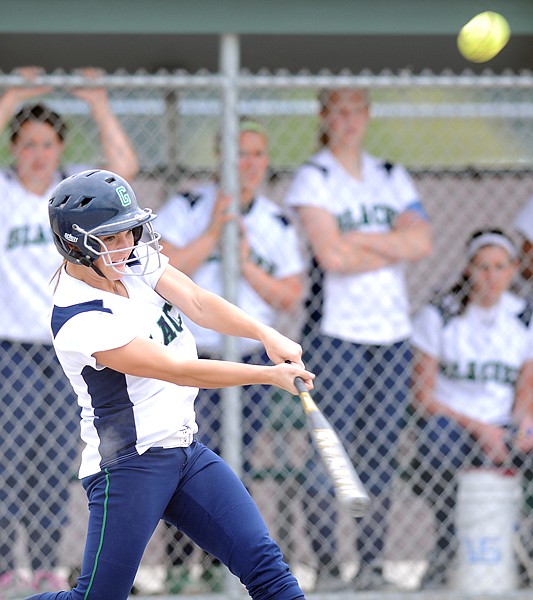 Glacier's Anna Costa (9) hits a single during the first inning of the game against Flathead on Tuesday in Kalispell.