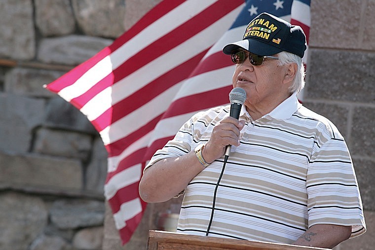 Tribal Culture Committee Director and Vietnam War veteran Tony Incashola addresses the crowd Wednesday at the opening of the People's Center's new Native Words Native Warriors exibit in Pablo.