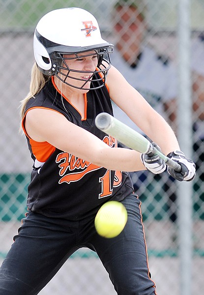 Flathead pitcher Sidney Alberts lays down a bunt during the second half of the game against Glacier on Tuesday afternoon.