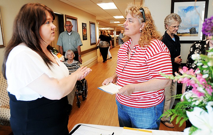 &lt;p&gt;April Webster, Expressions Director, welcomes guest to the open house including Michele Glazier of Kalispell, on Wednesday, May 14, in Kalispell. (Brenda Ahearn/Daily Inter Lake)&lt;/p&gt;