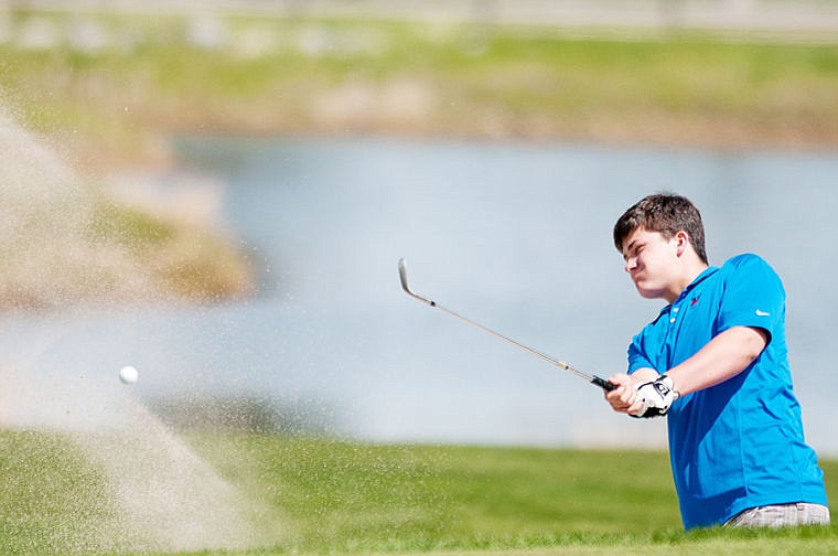 &lt;p&gt;Bigfork's Ryder Trent hits out of a bunker on the second hole on the Osprey Nine course Tuesday during the Class B divisional golf tournament at Eagle Bend Golf Club in Bigfork. May 13, 2014 in Kalispell, Montana. (Patrick Cote/Daily Inter Lake)&lt;/p&gt;